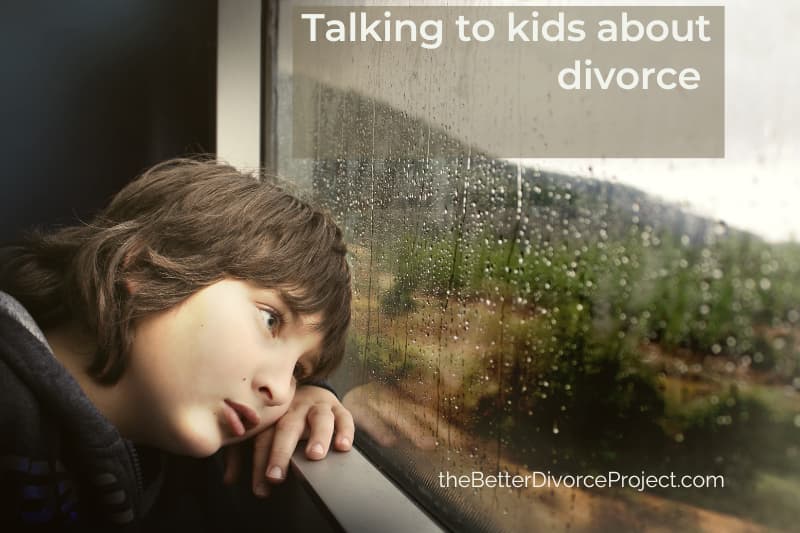 Talking to children about divorce can be good news. Young boy - about 8 years old with head on window sill sadly looking through a rain swept window.